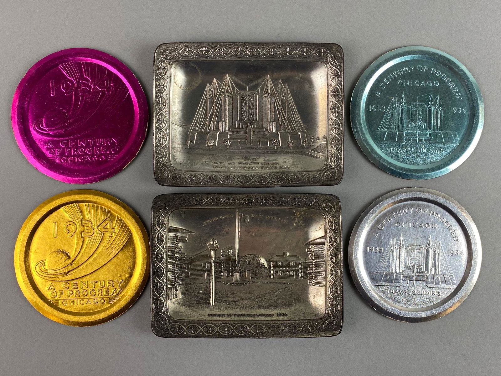 Group of 6 Worlds Fair Items: Include 2 Metal trinket dishes and 4 coasters, 1933-34, condition consistent with age, largest measures 5 1/4 X 3 3/4 X 1/2 inches