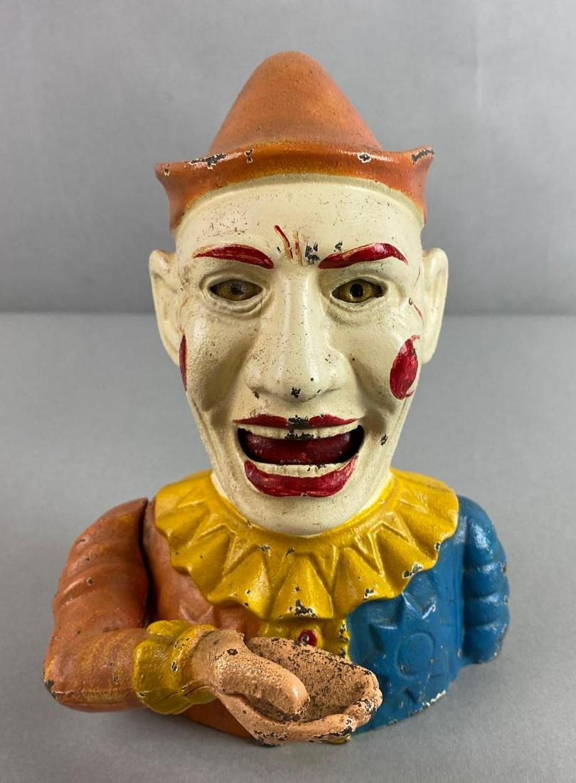 Cast Iron Clown Bank: Reproduction of an original in collection of the Book of Knowledge, paint loss, measures 7 1/2 X 6 X 6 inches