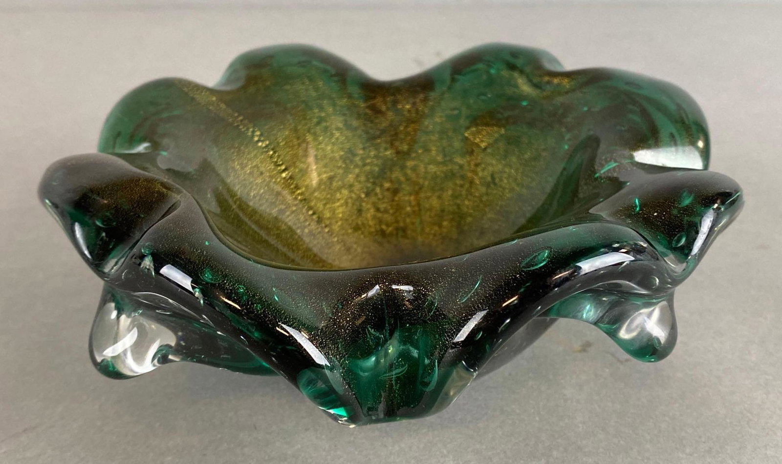 Green Glass Gold Dust Art Glass Ashtray: Measures 2 1/2 x 7 x 7in.