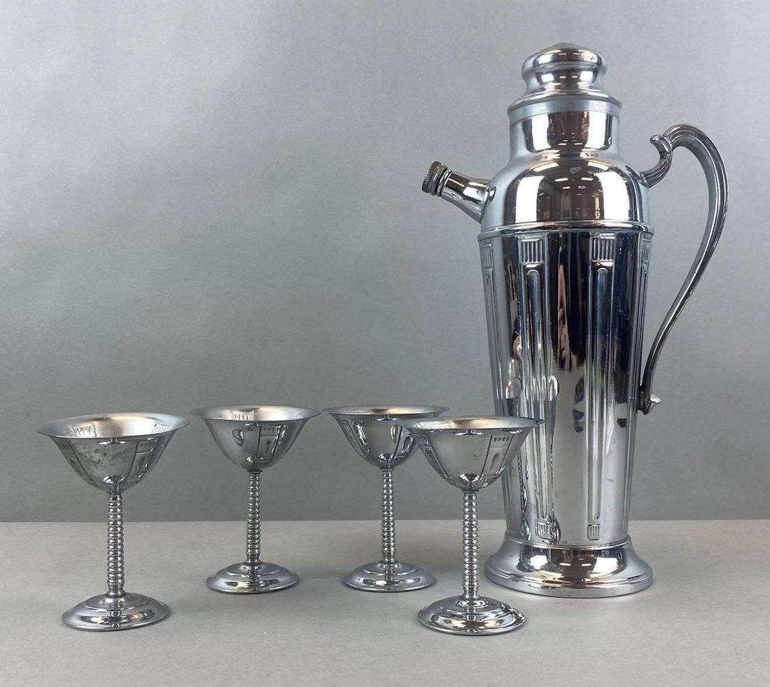 Group of 5 Stainless Chrome Shaker Set: 4 goblets, largest measures 13 1/2 x 7 x 4 inches