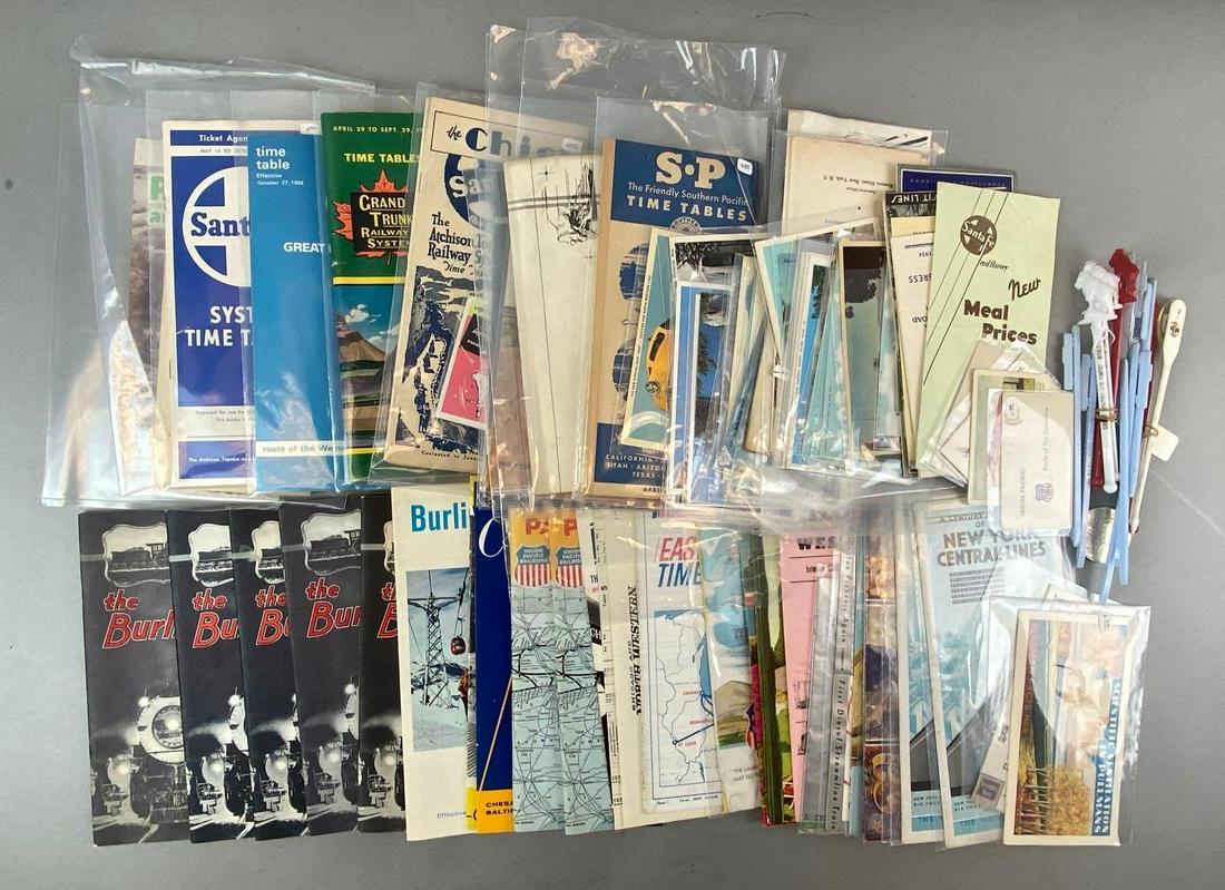 Group of 30+ Assorted Train Ephemera and More: Includes time tables, map routes, drink stirrers, and more. Largest measures 8 1/2 x 5 1/2 inches