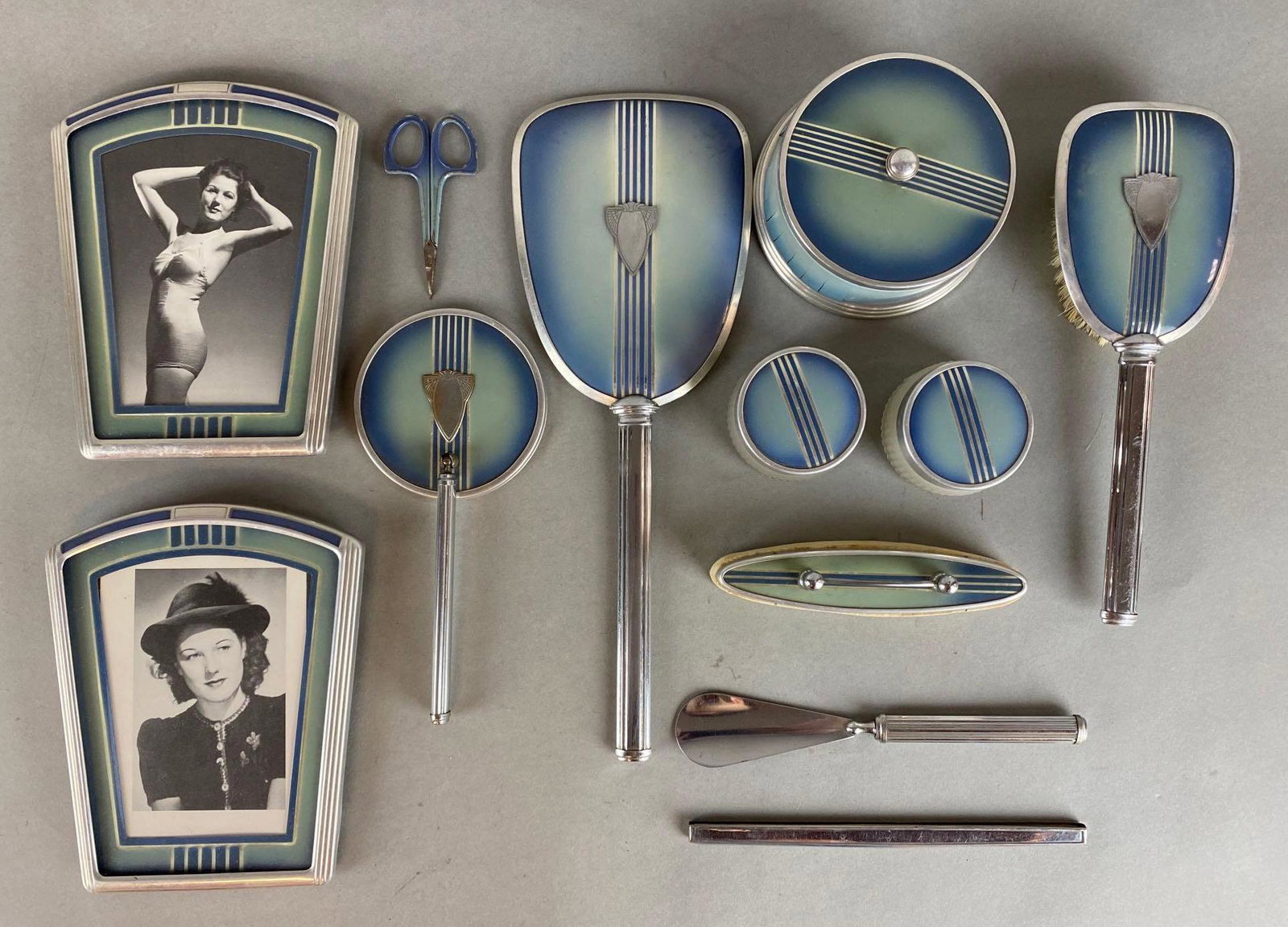 Mid-Century Modern Art Deco Dresser Set: Includes picture frames, hand mirrors, hairbrush, jars, and more, Some small broken pieces, Hand mirror measures 12 1/4 x 4 1/2in.