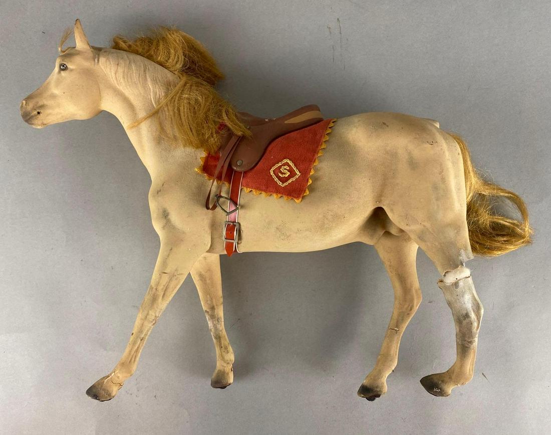 Vintage Composite Toy Horse: Hooves on castors, Back left leg broken off, Some cracks throughout, Measures 15 1/2 x 18 1/2 x 4 1/2in.