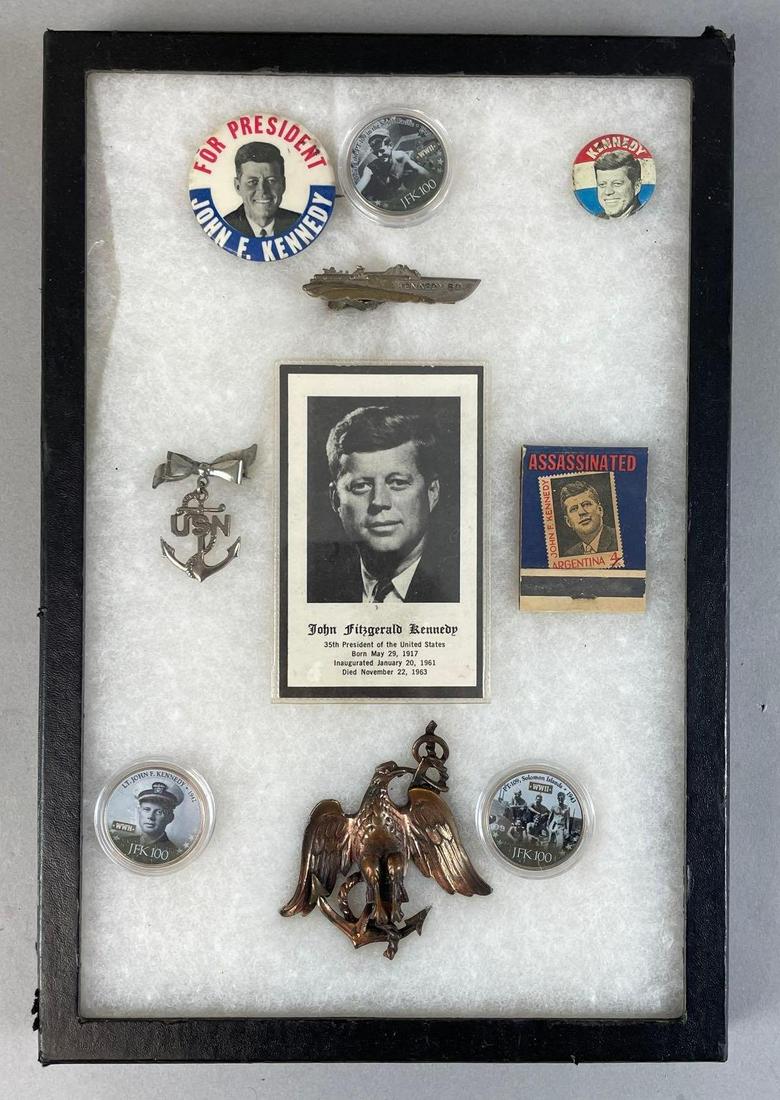 Group of 10 JFK Memorial Items: Includes 3 JFK 100 coins, death card, USN pins, and more. Includes 12 x 8 glass riker case