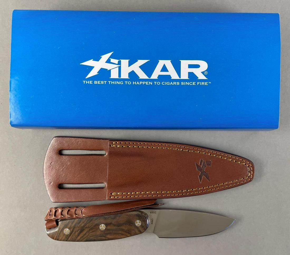 Xikar Fixed Blade Knife with Sheath: Walnut handle. Includes original packaging. Knife measures 7 3/4 inches overall with a 3 1/2 inch blade