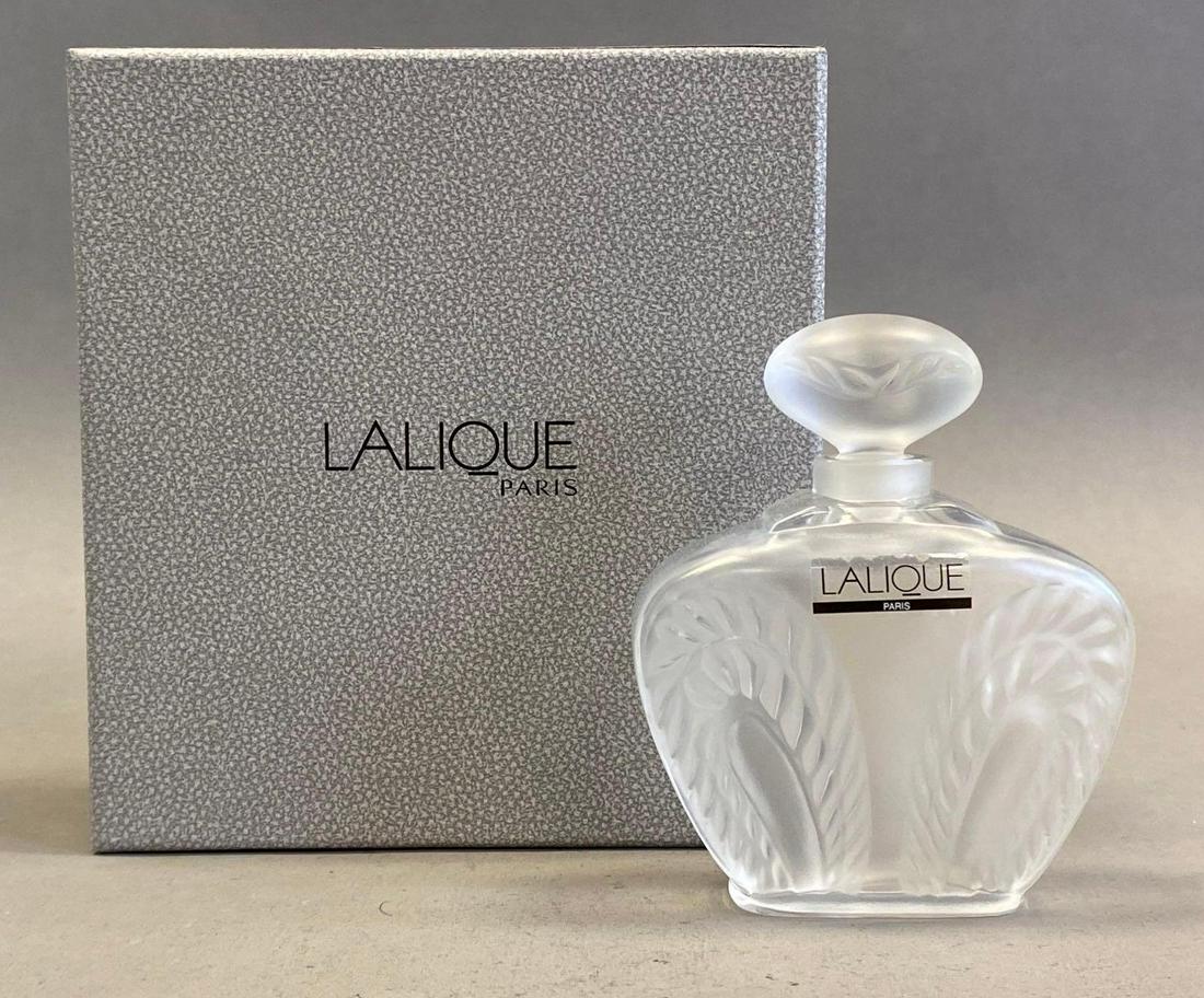 Lalique Paris Etched Crystal Perfume Bottle: With original box, Box measures 5 3/4 x 5 1/4 x 2in, Perfume bottle measures 4 x 3 1/4 x 1 1/4in.