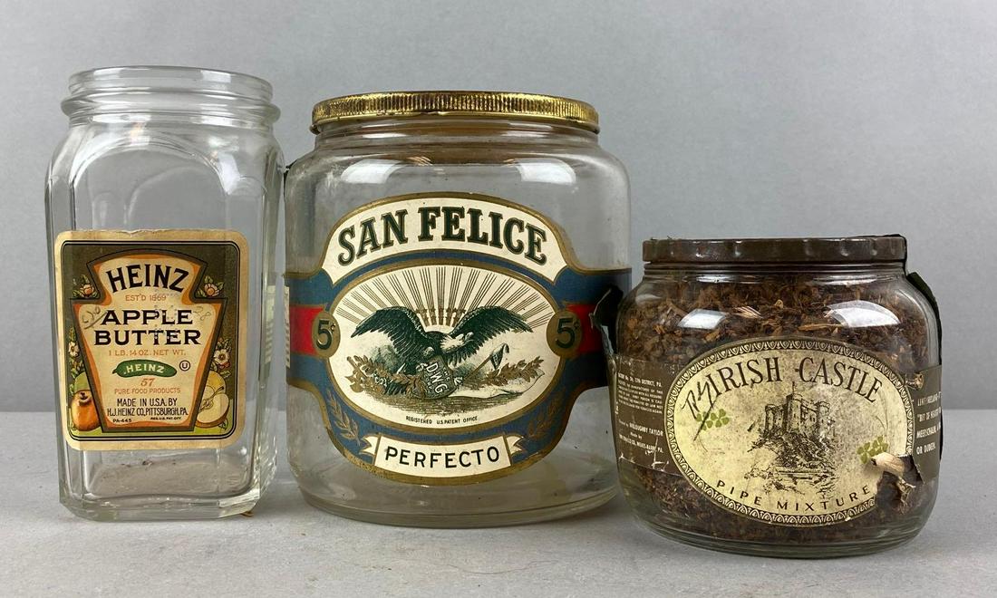 Group of 3 Advertising Glass Containers: Includes Heinz apple butter, San felice perfecto, and Irish-castle pipe mixture (sealed). Largest measures 6 1/2 x 5 1/2 inches