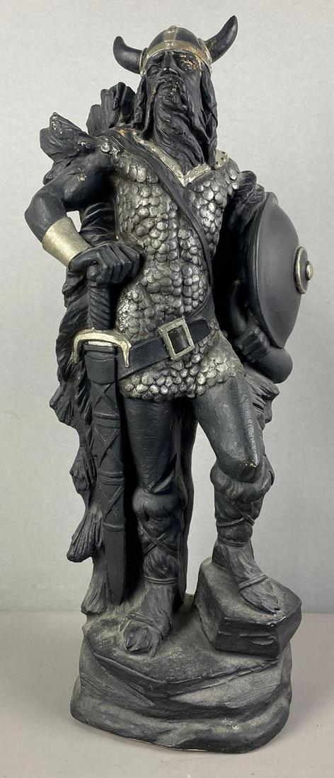 Viking Plaster Figure: One horn chipped. Measures 20 1/2 x 9 x 6 inches