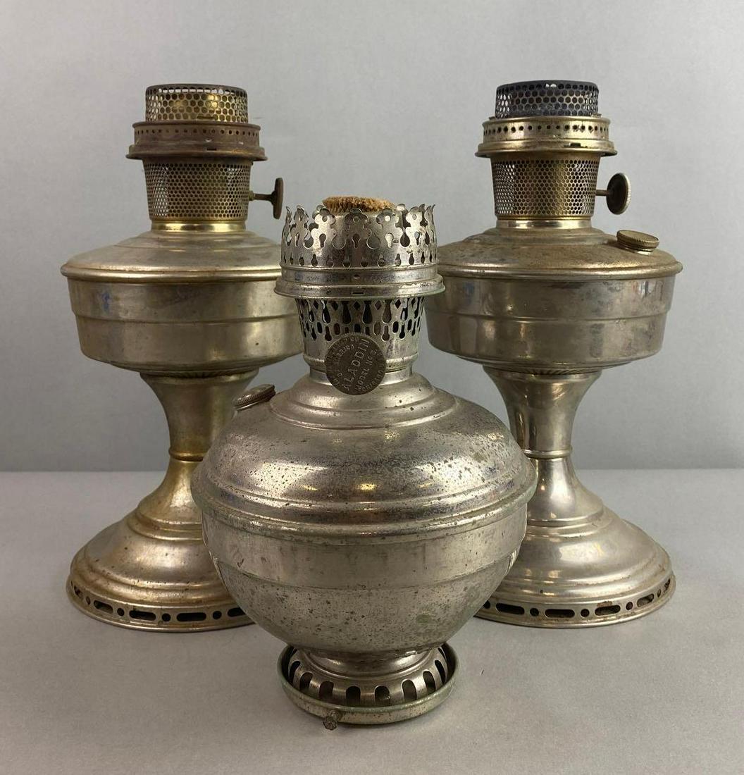 Group of 3 Vintage Aladdin Metal Oil Lamps: Condition consistent with age, largest measures 11 3/4 X 6 inches
