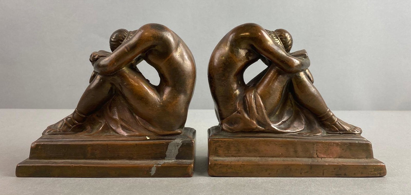Grecian Solitude Bronze Bookends: Unmarked, condition consistent with age, measures 5 1/4 X 6 X 2 3/4 inches