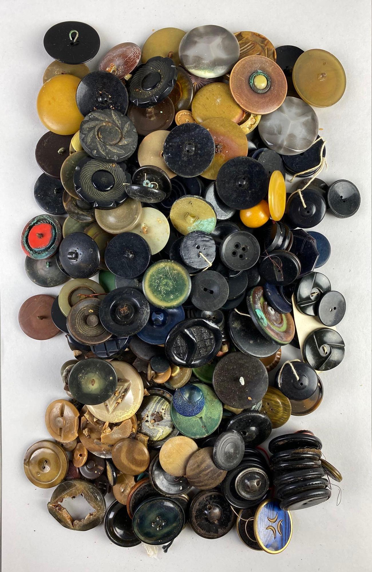 Group of 100+ Assorted Buttons: various sizes and designs, includes duplicates, some cracked, largest measures 1 3/4 inches