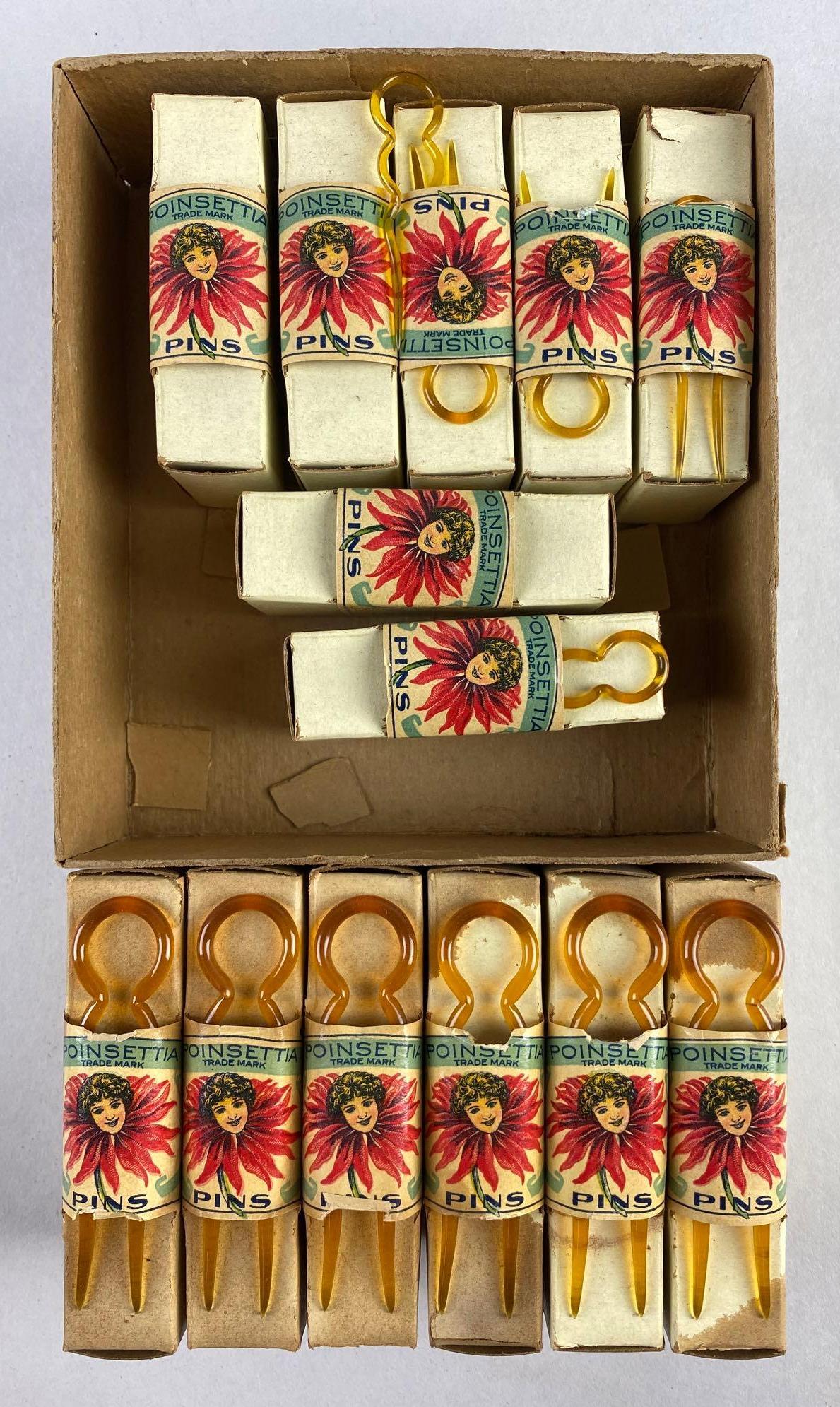 Group of Vintage Poinsettia Hair Pins: With original boxes, condition consistent with age, large pins measure 3 x 3/4 inches, small pins measure 2 X 1/2 inches