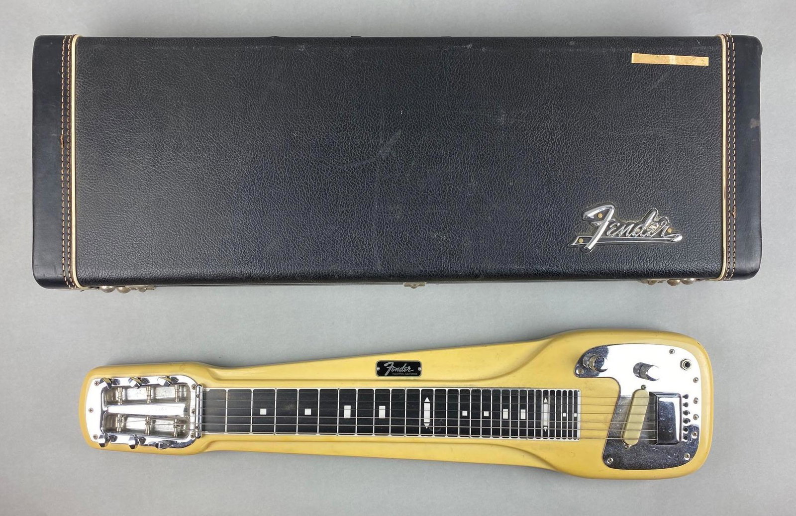 Fender 6 String Steel Lap Guitar with Case: Fullerton, California. With legs and accessories. Amp output tests good. 31 x 7 x 2 inches
