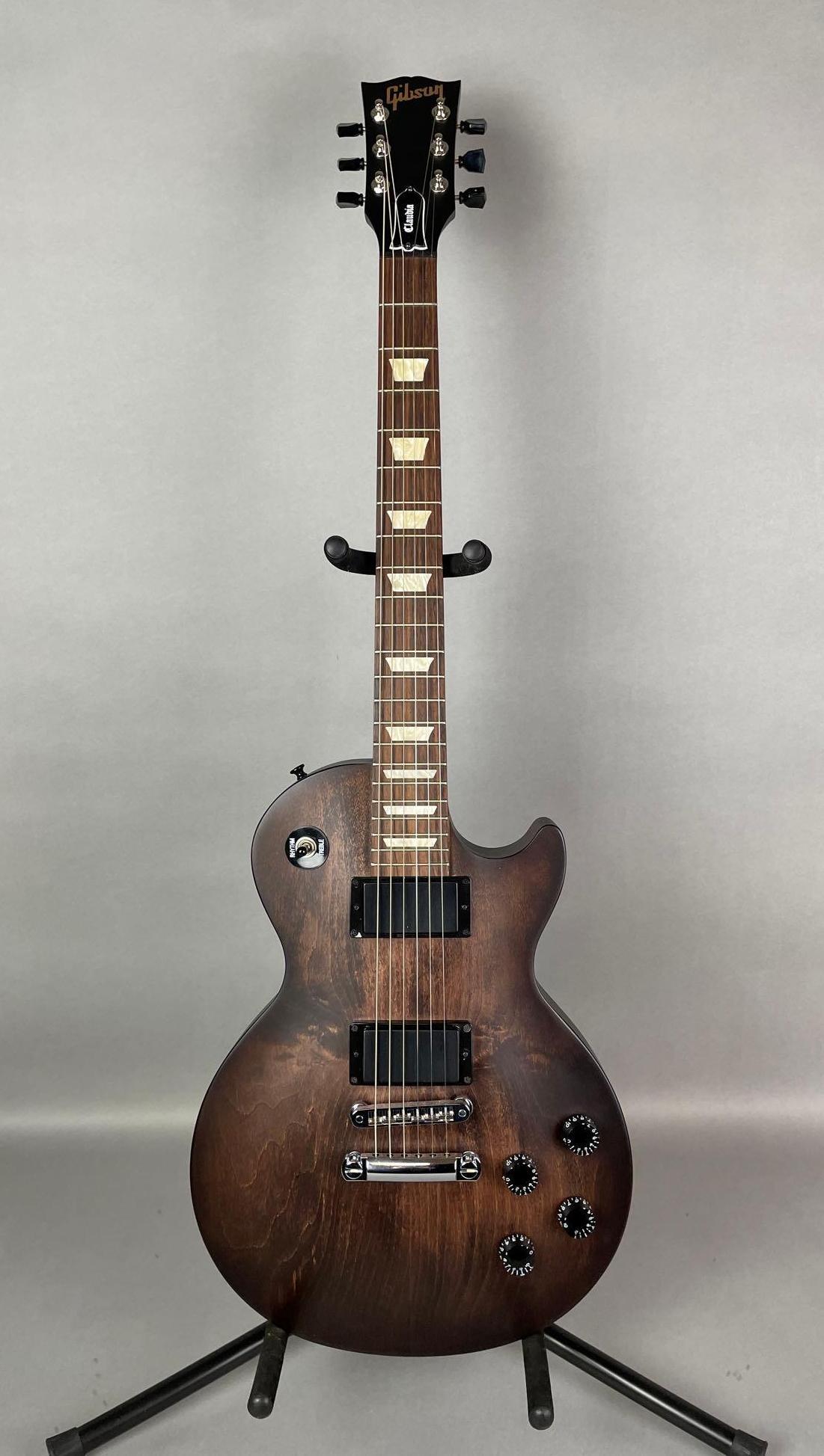 2013 Gibson Les Paul Studio Model Electric Guitar with Hard Case: like new condition solid body, satin finish. includes hard case, papers, and more. made in USA, measures 28 1/2 x 12 3/4 inches