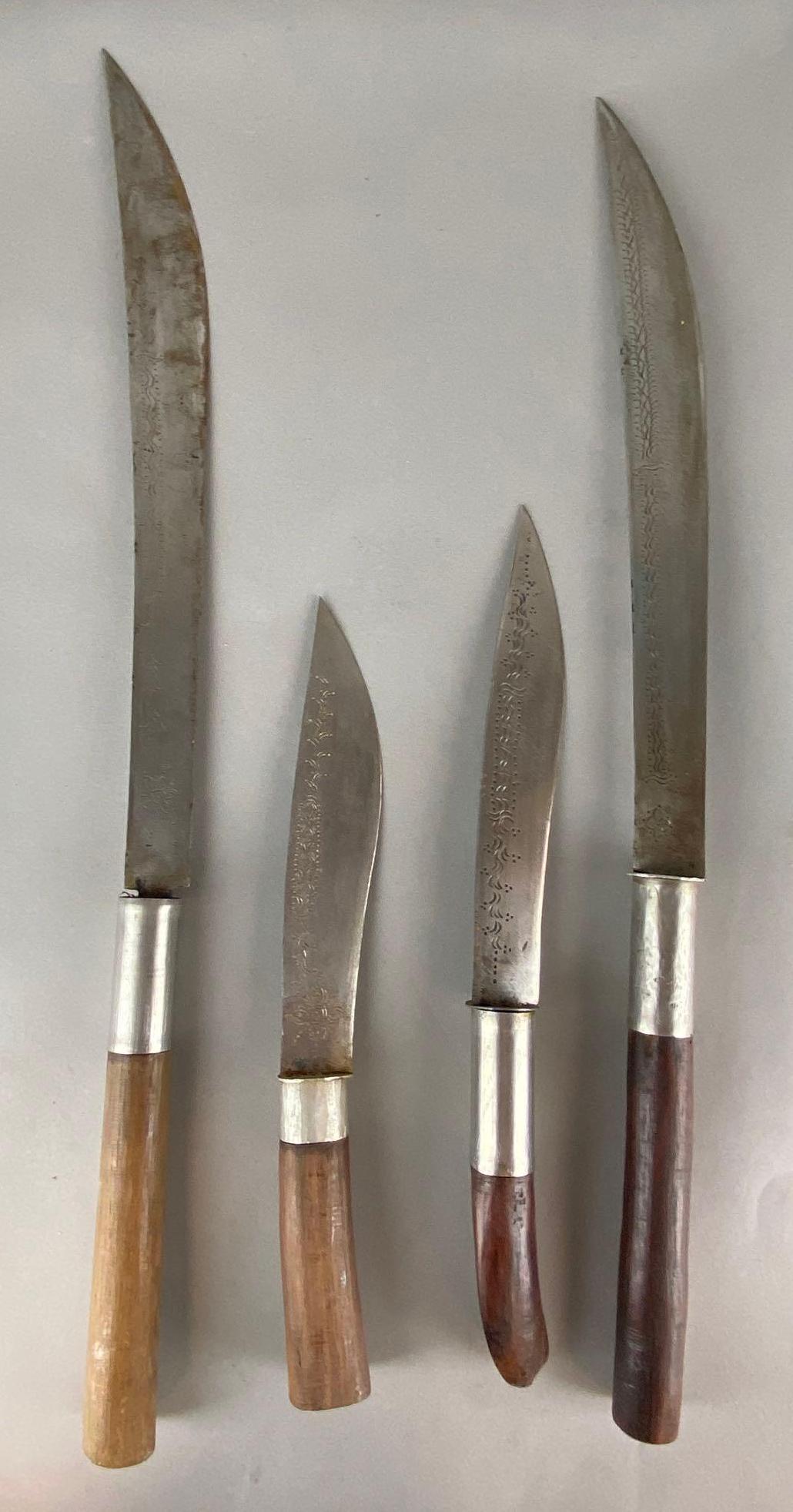 Group of 4 Wood Handled Etched Blade Knives: All with wood sheaths, Longest measures 25in long with 16in blade.