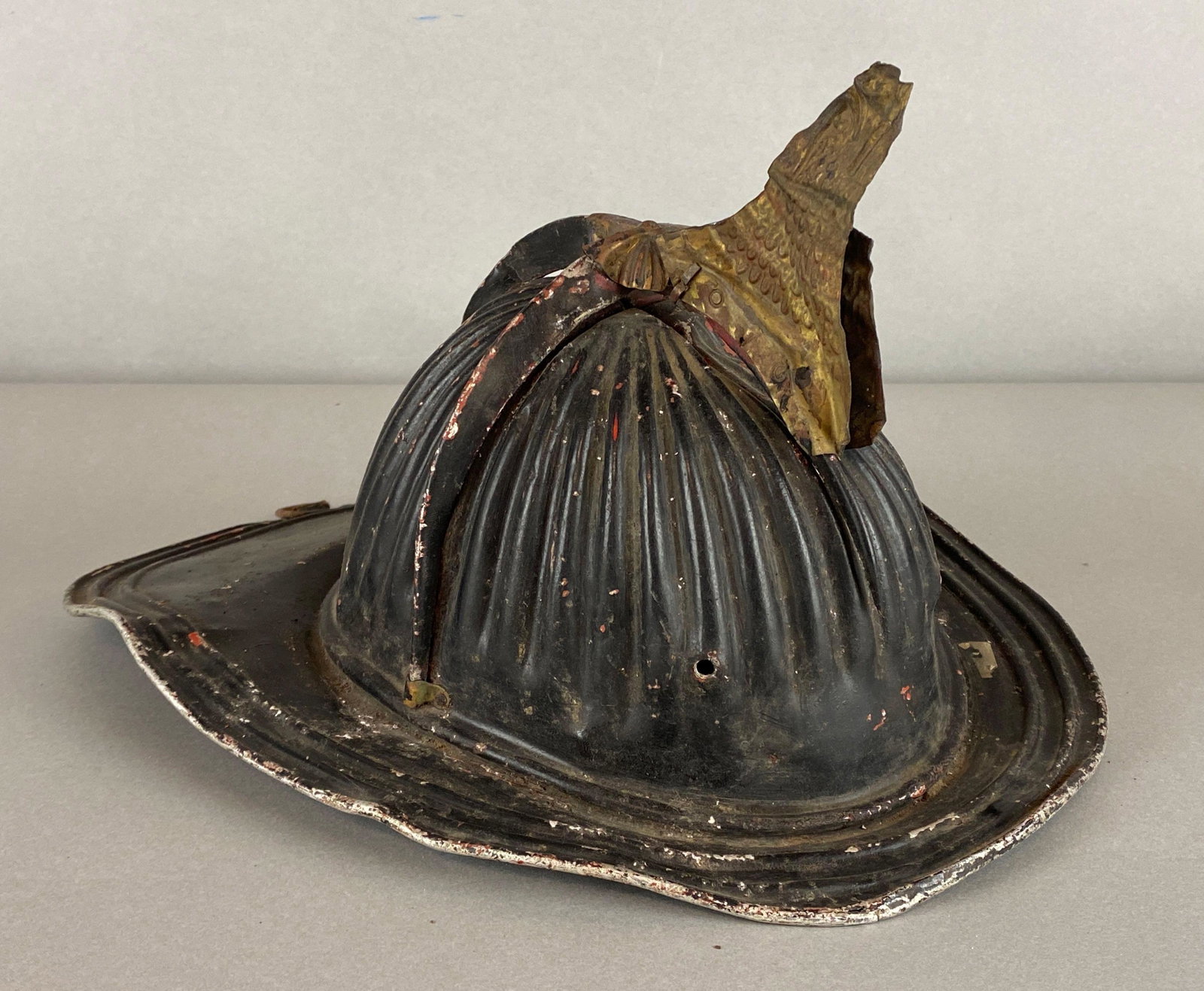 Vintage High Eagle Black Metal Fire Helmet: One eagle head broken off, Some dents and scratches throughout, Measures 8 1/2 x 13 1/2 x 10 1/2in.