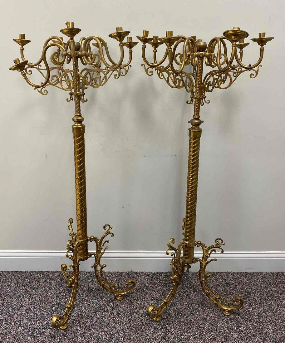 Antique Pair of Metal Ornate Candelabras: One candlestick holder is broken. Measures 52 1/2 inches tall, 22 inches wide. NO IN-HOUSE SHIPPING, 3rd party shipper recommended.