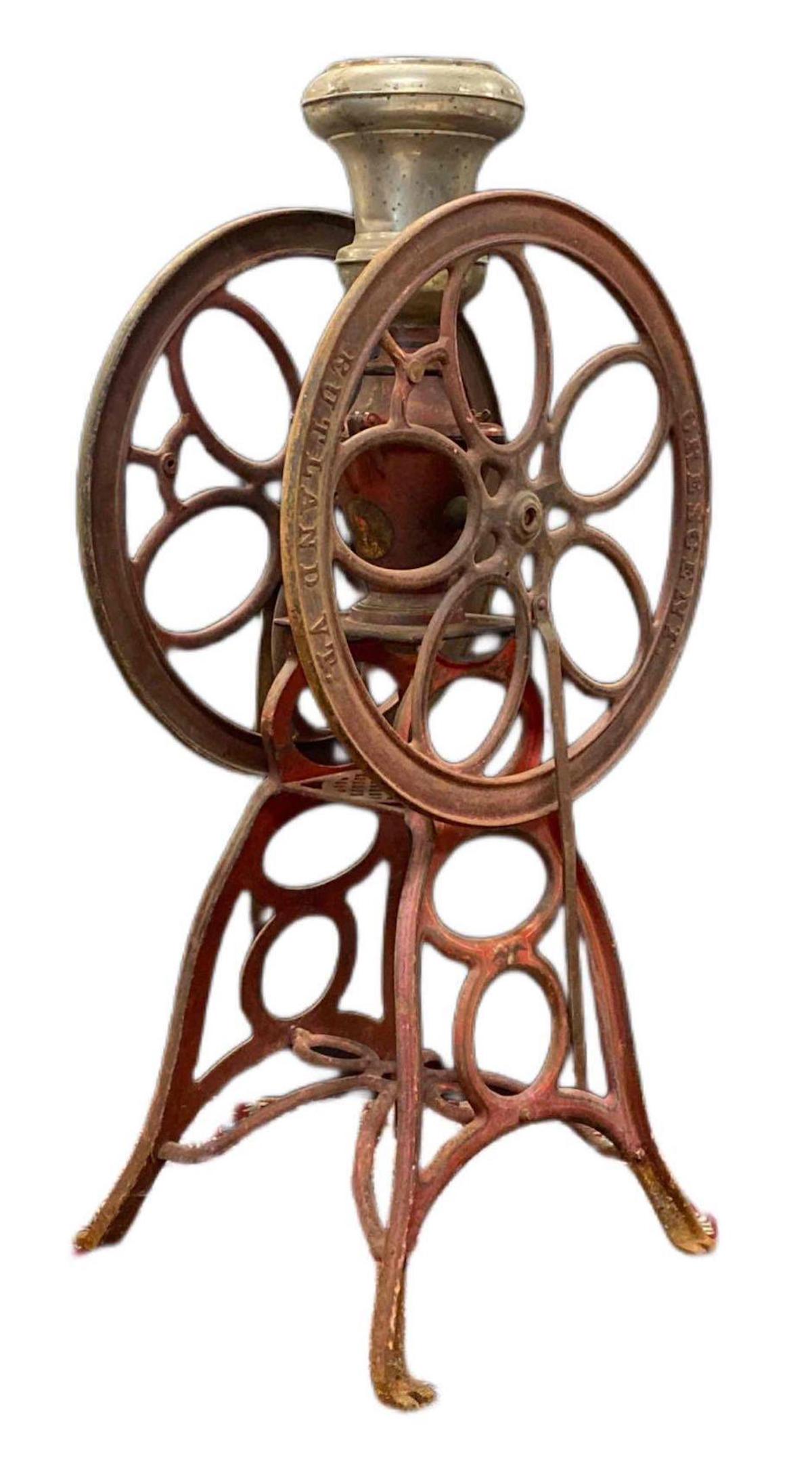 Large Antique Crescent Cast Iron Coffee Grinder: Rutland, Vermont. Missing parts. Measures 31 1/2 x 16 x 62 1/2 inches. NO IN-HOUSE SHIPPING, 3rd party shipper recommended.