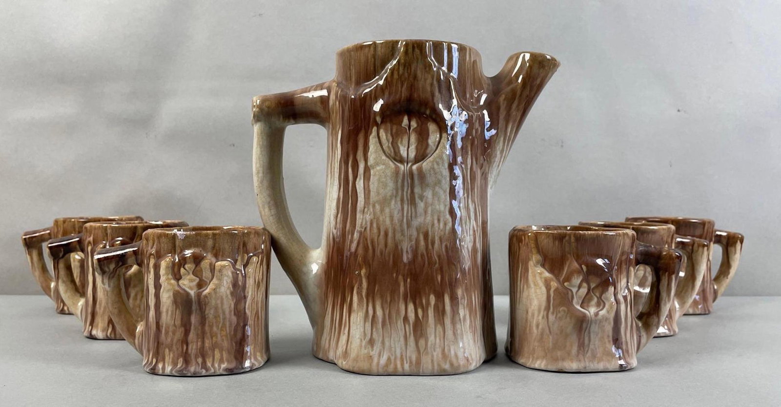 Group of 7 Stoneware Pitcher and Mugs: Pitcher measures 8 1/2 x 9 x 5 inches