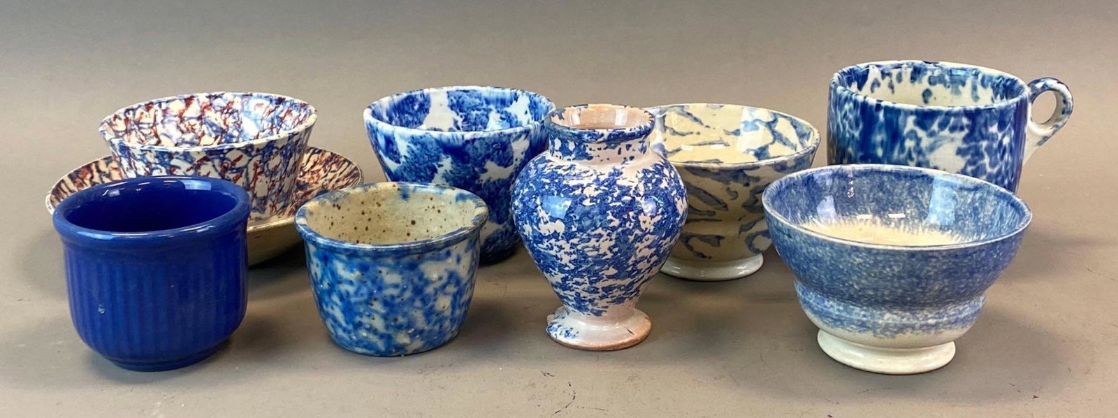 Group of 9 Blue and White Spongeware Mugs and More: Includes mugs, teacup and saucer, vase, bowls, abs more, Largest measures 3 1/2 x 4 1/2 x 3 3/4in.