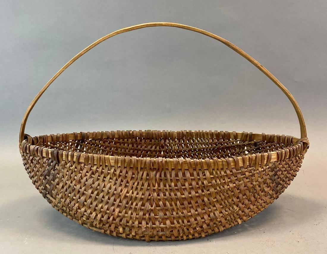 Oblong Splint Buttocks Woven Basket: Handled basket, Some splitting along bottom edge, Measures 12 x 17 1/2 x 8 1/2in.