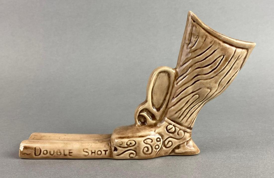 Dorothy Kindell Double Shot Firearm Ceramic Shot Glass: Circa 1940s, unmarked, crazing, small chip, measures 5 X 7 X 1 1/2 inches