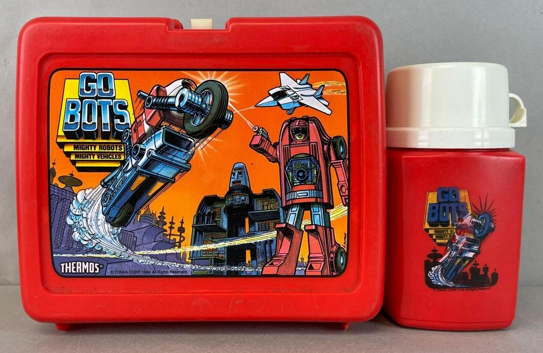 1984 Thermos Go Bots Plastic Lunch Box: Includes thermos container. Box measures 7 3/4 x 8 1/2 x 4 inches
