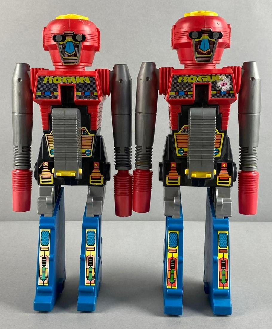 Group of 2 Robot Cap Guns: Unknown working condition. 14 x 6 x 3 1/2 inches