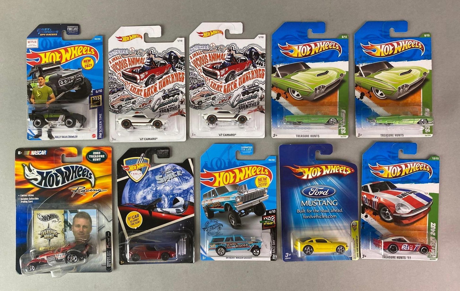 Group of 10 Hot Wheels Die-Cast Vehicles: 2000-2020, Mattel, Includes HW Screen Time Rally Baja Crawler, Treasure Hunts 1963 T-Bird, 2008 Tesla Roadster, and more, In original packaging.