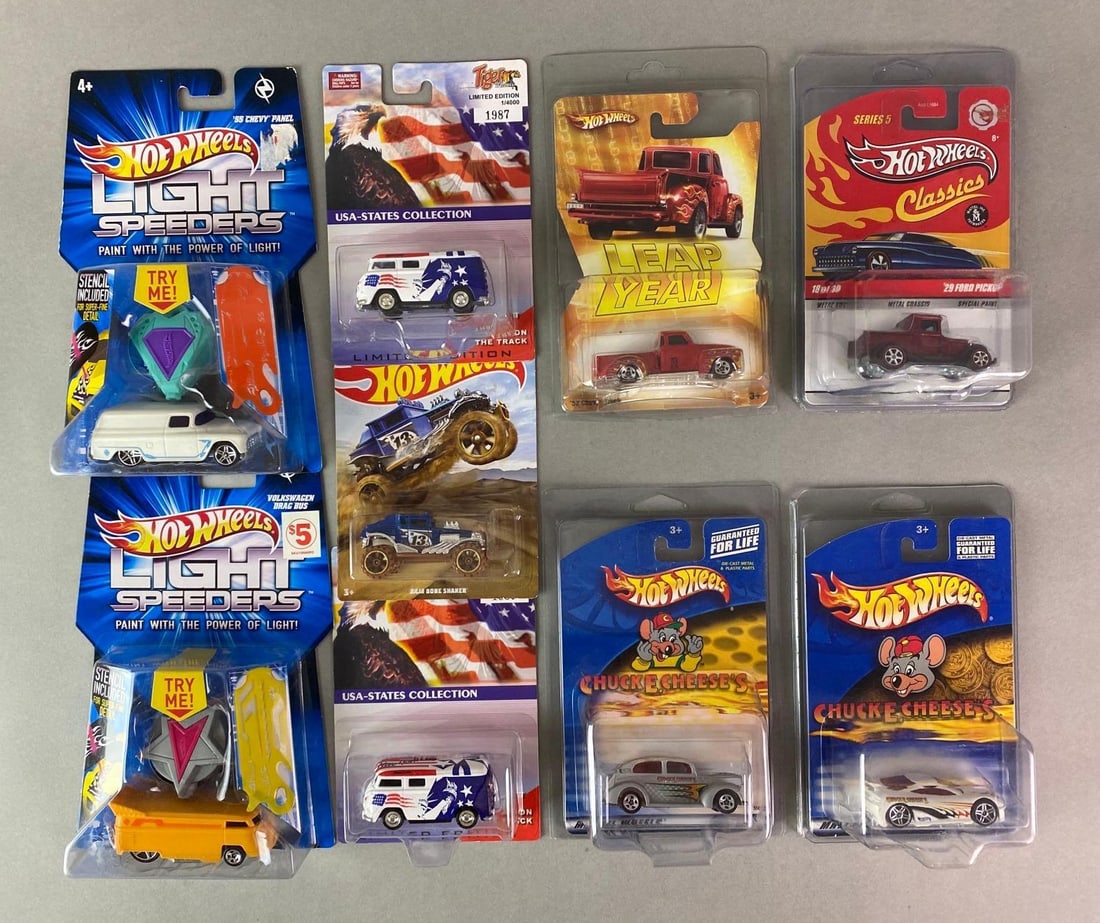 Group of 9 Hot Wheels Doe-Cast Vehicles and More: Includes Light Speeders 1955 Chevy Panel, Chuck E. Cheese, Leap Year 1952 Chevy Truck, and more, Largest packaging measures 8 3/4 x 5 1/2 x 1 1/2 inches.