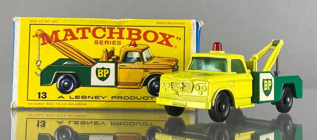 Matchbox No. 13 Dodge Wreck Truck: With box, Lesney, Made in England. Color: Yellow and Green, Clear Windows, Black Plastic Wheels, Green Base, Die-Cast.