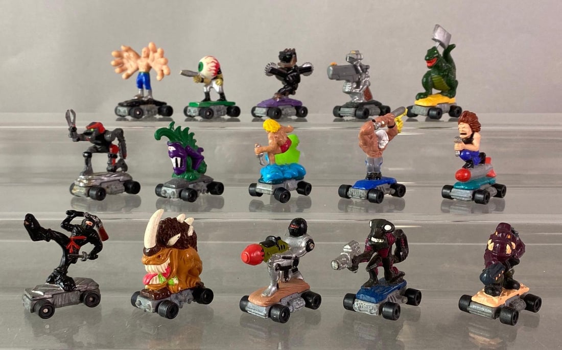 Group of 15 Kenner Savage Mondo Blitzer Die-Cast Vehicles: 1991-1992, Includes Tyrannosaurus Ax, Big Hans, Gun Runner, and more, All measure 1 1/2 inches tall.