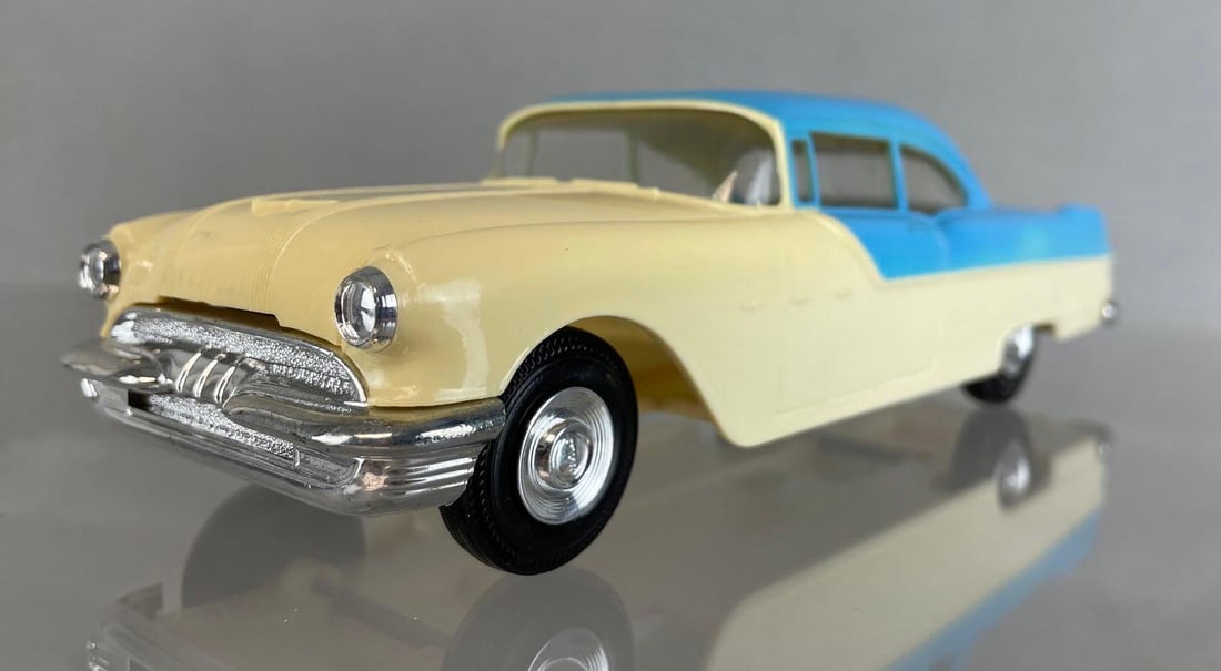 Jo-Han 1955 Pontiac Star Chief 2 Door Hardtop Dealership Promo Car: two tone yellow and blue, non-friction. Measures 8 1/4 x 3 x 2 1/2 inches
