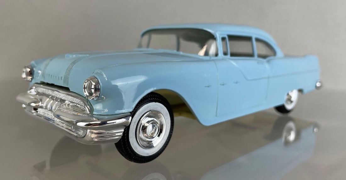 Jo-Han 1955 Pontiac Star Chief Reissue Dealership Promo Car: baby blue, non-friction. Measures 8 1/4 x 3 x 2 1/2 inches