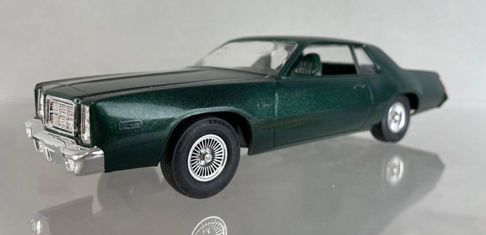 Dodge Monaco 2 Door Hardtop Dealership Promo Car: Late 70s, dark green interior and exterior. Non-friction. Measures 8 1/4 x 3 x 2 1/4 inches