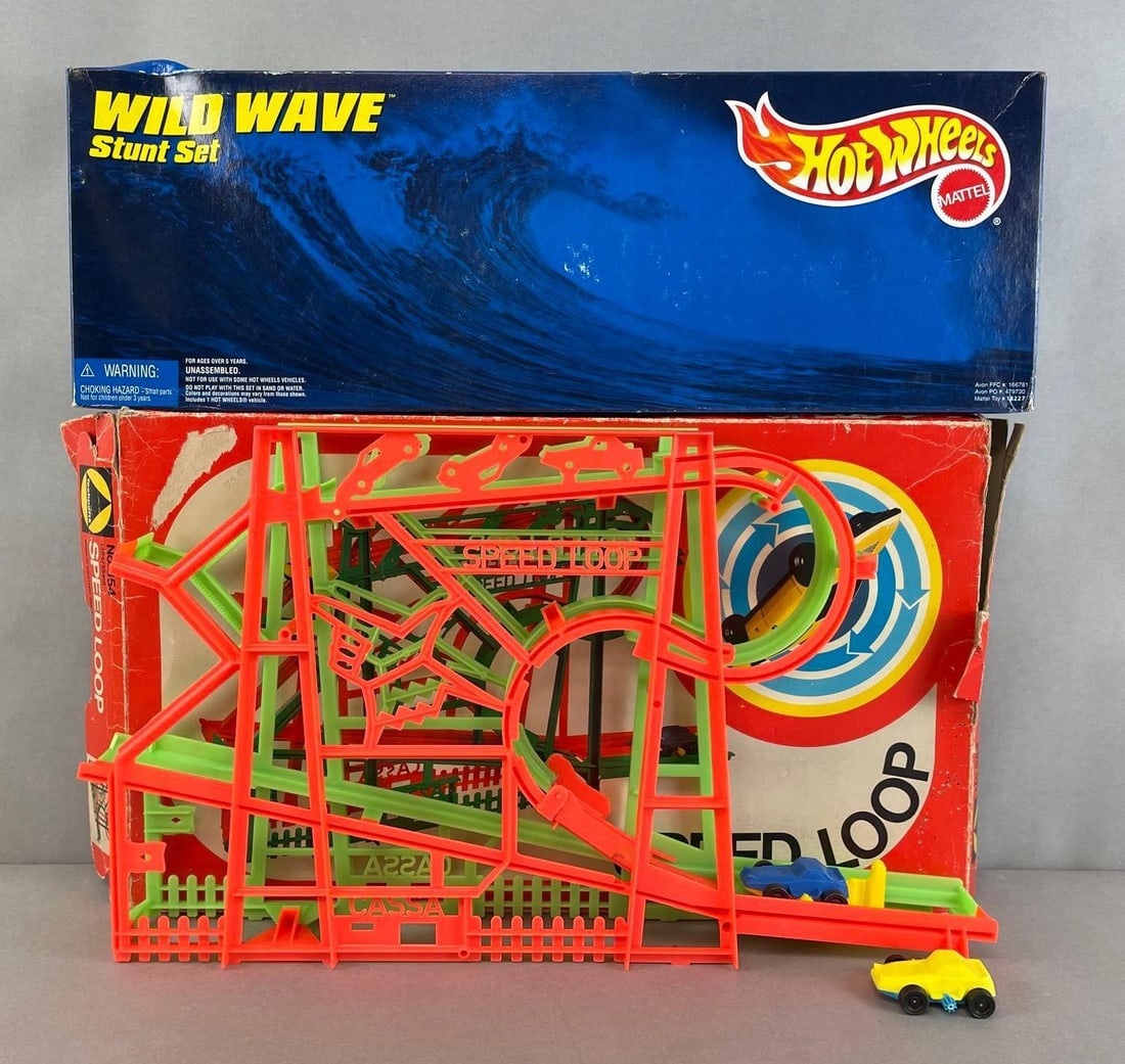Group of 2 Toy Car Stunt Sets: Includes sealed Mattel hot wheels wild wave stunt set, working condition technofix speed loop with 2 cars and beat up original box. Largest box measures 19 x 11 1/2 x 2 1/2 inches