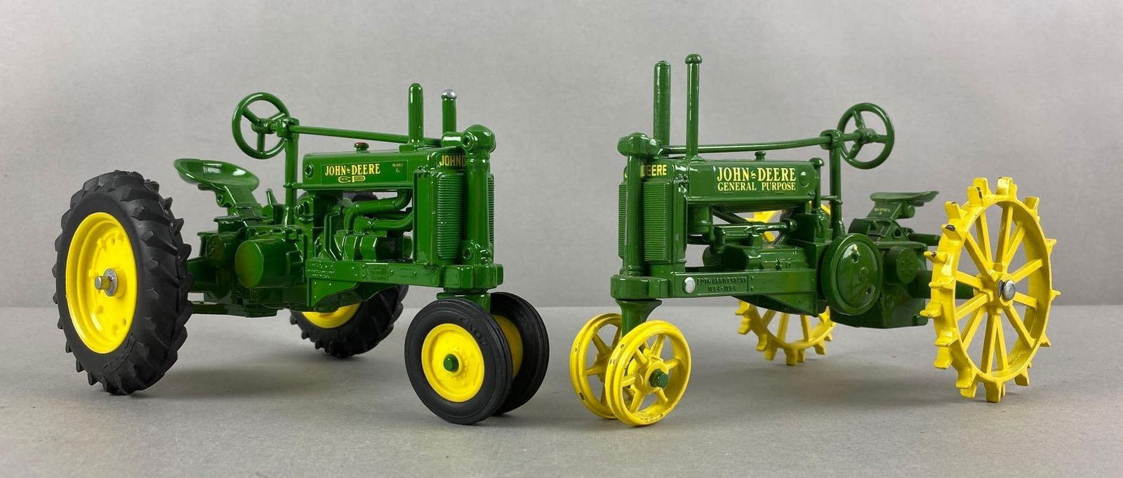 Group of 2 John Deere Die-Cast Tractors: Includes John Deere G 548 and Model A General Purpose, largest measures 8 x 5 x 5 inches.