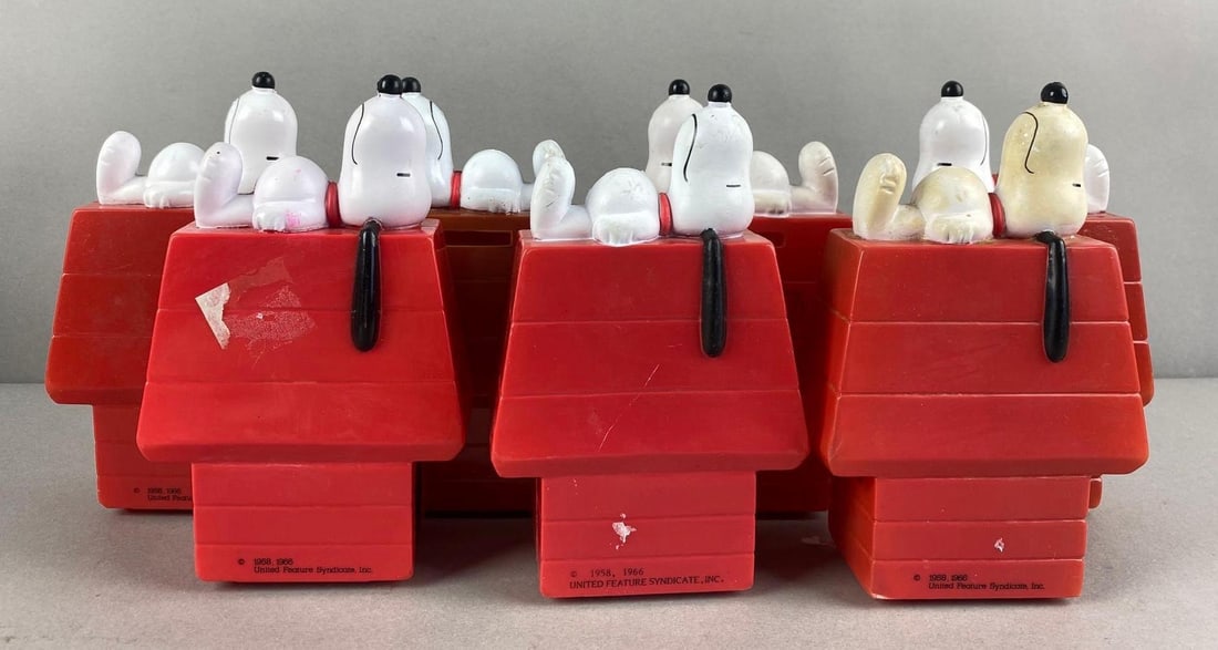 Group of 7 Vintage Snoopy Coin Banks: Plastic, some with sticker residue and flaws. 1958 1966, measures