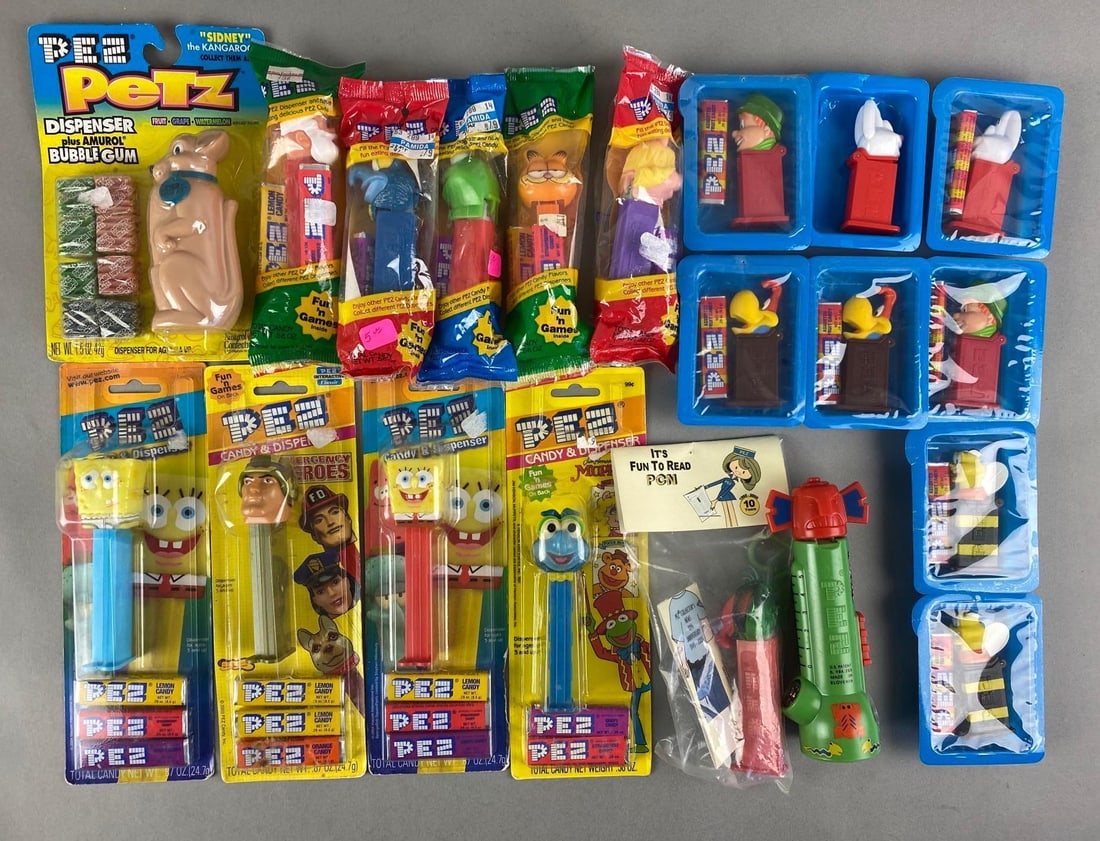 Group of 20 Assorted PEZ Dispensers: Includes Kermit, SpongeBob, lucky charms leprechaun, and more. Largest measures 6 inches tall