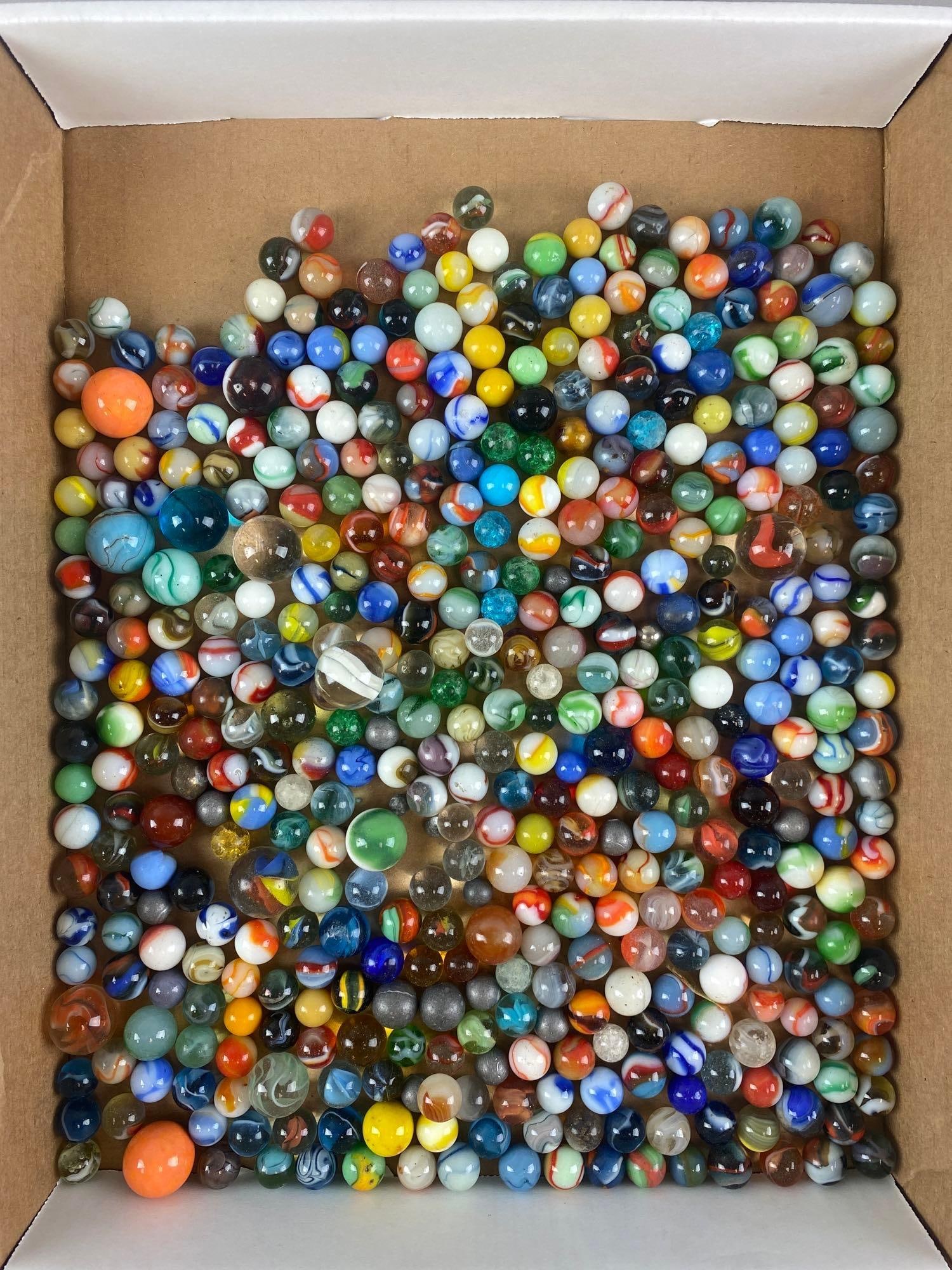 Group of 300+ Marbles: Includes catseye, metal, shooters, and more. Largest measures .988 inches