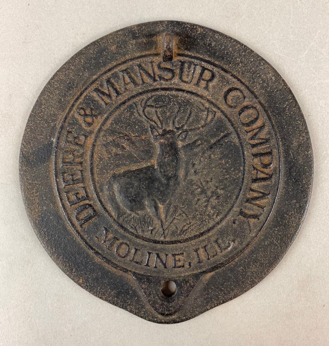 Moline Illinois Deere and Mansur Company Advertising Corn Planter Lid: Patented 1895, Cast Iron, Image of Buck in center, Measures 7 1/4 x 7 1/2 x 1/2 inches.