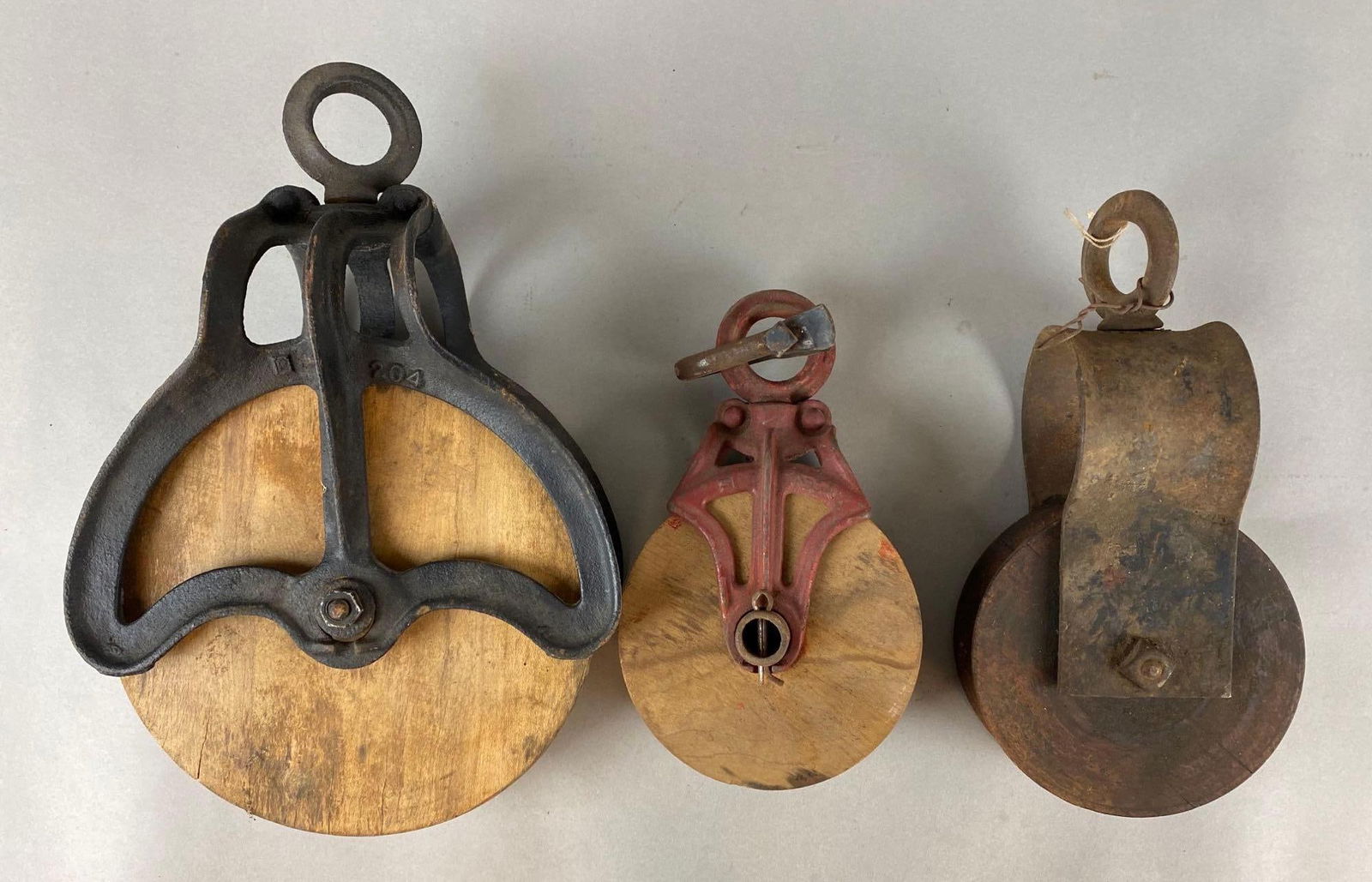 Group of 3 Vintage Cast Iron and Wood Pulleys (1 of 3)