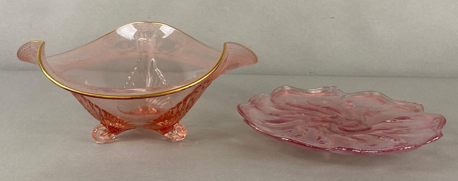 Group of 2 Pink Glass Decorative Items: Includes International Carnival Glass Association 1995 Fenton glass tray, and Encrusted Fox Hunt Gold boarder pedestal dish, Largest measures 11 3/4 x 11 3/4 x 5 1/4 inches.
