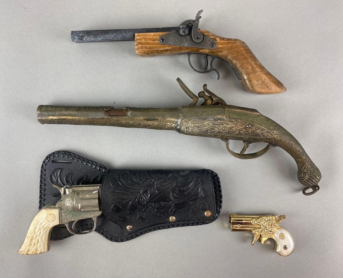 Group of 4 Toy Pistols and Lighter: Includes Hubley Stag Grip (plastic) cap gun, mother of Pearl Modern Angel mascot lighter, and more. All in non working condition, largest measures 15 inches long.