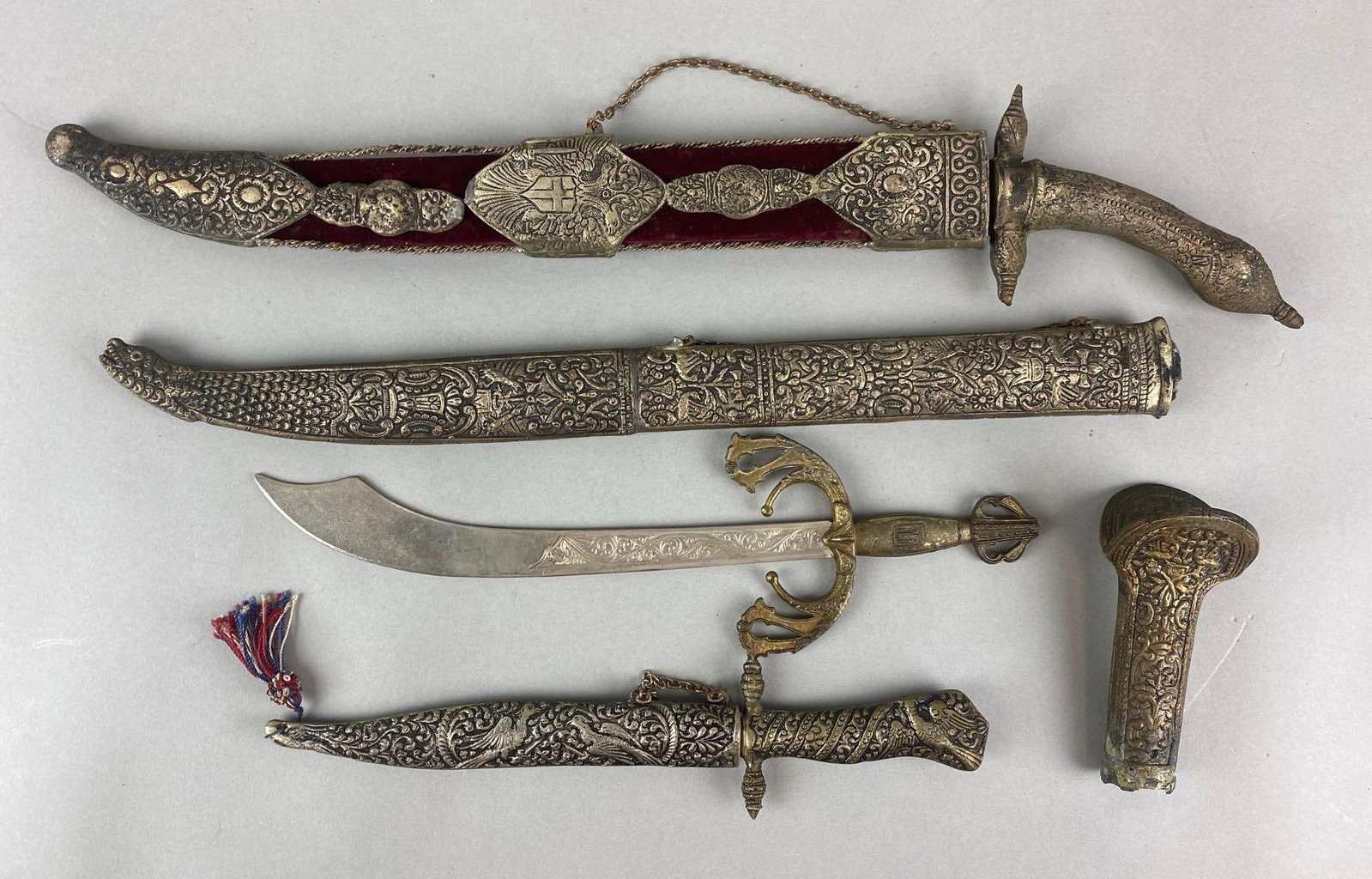 Group of 5 Ceremonial Knives and More: Includes 3 blades, 1 sheath, and 1 hilt. One blade marks Athens. Largest measures 22 inches long (with sheath)