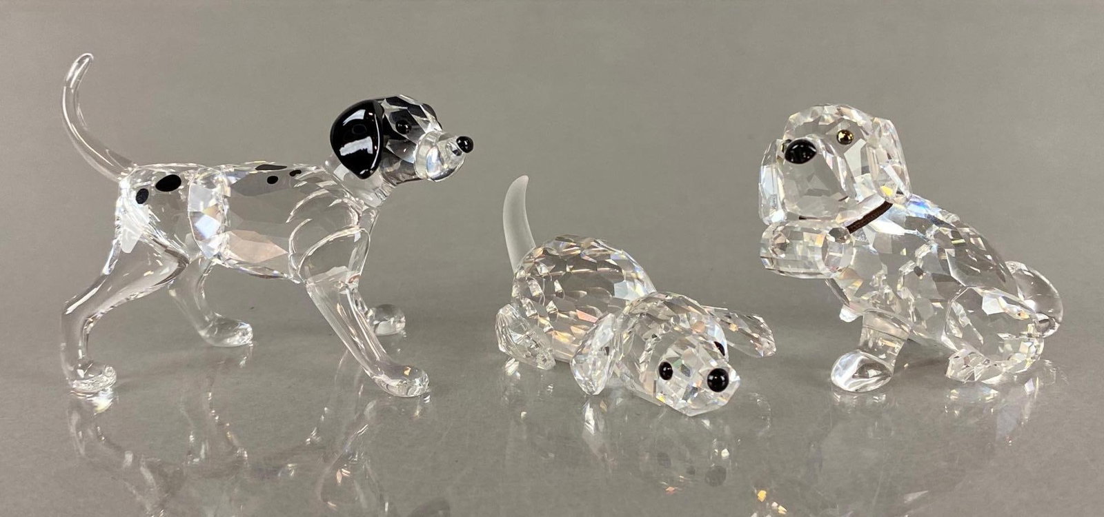 Group of 3 Swarovski Crystal Puppies with Boxes: Includes St. Bernard, Dalmatian, and other, All with certificates, All with boxes, One box does not match figure, St. Bernard missing one foot, Dalmatian puppy measures 1 1/2 x 2 1/4 x 1 1/4 inches, L