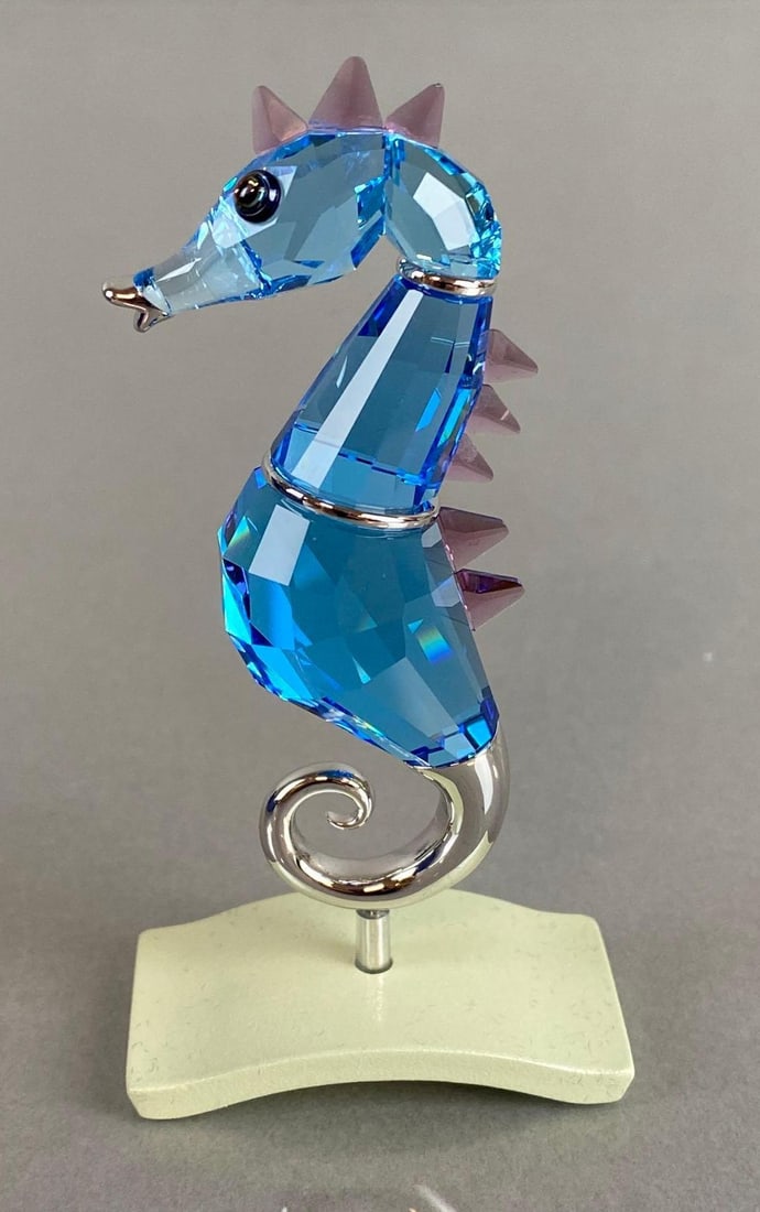 Swarovski Crystal Aquamarine Chipili Seahorse with Box: 2004, With certificate, Figure measures 3 3/4 x 1 3/4 x 1 inches attached to base, Box measures 4 1/2 x 4 1/4 x 2 inches.
