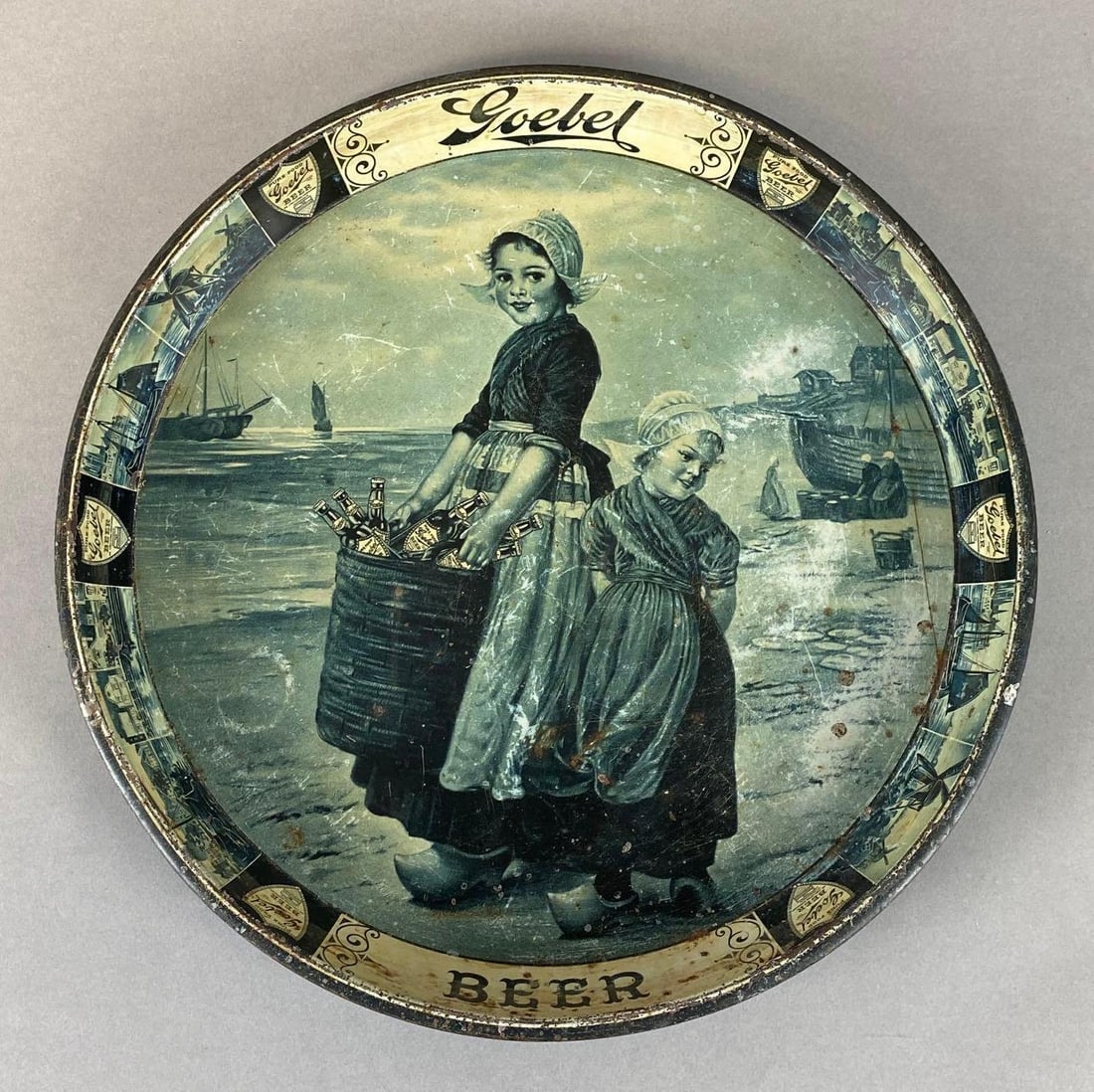 Goebel Beer Metal Advertising Tray: Some wear on face of tray, some adhesive or tape on back. Measures 12 x 12 x 1 inches.