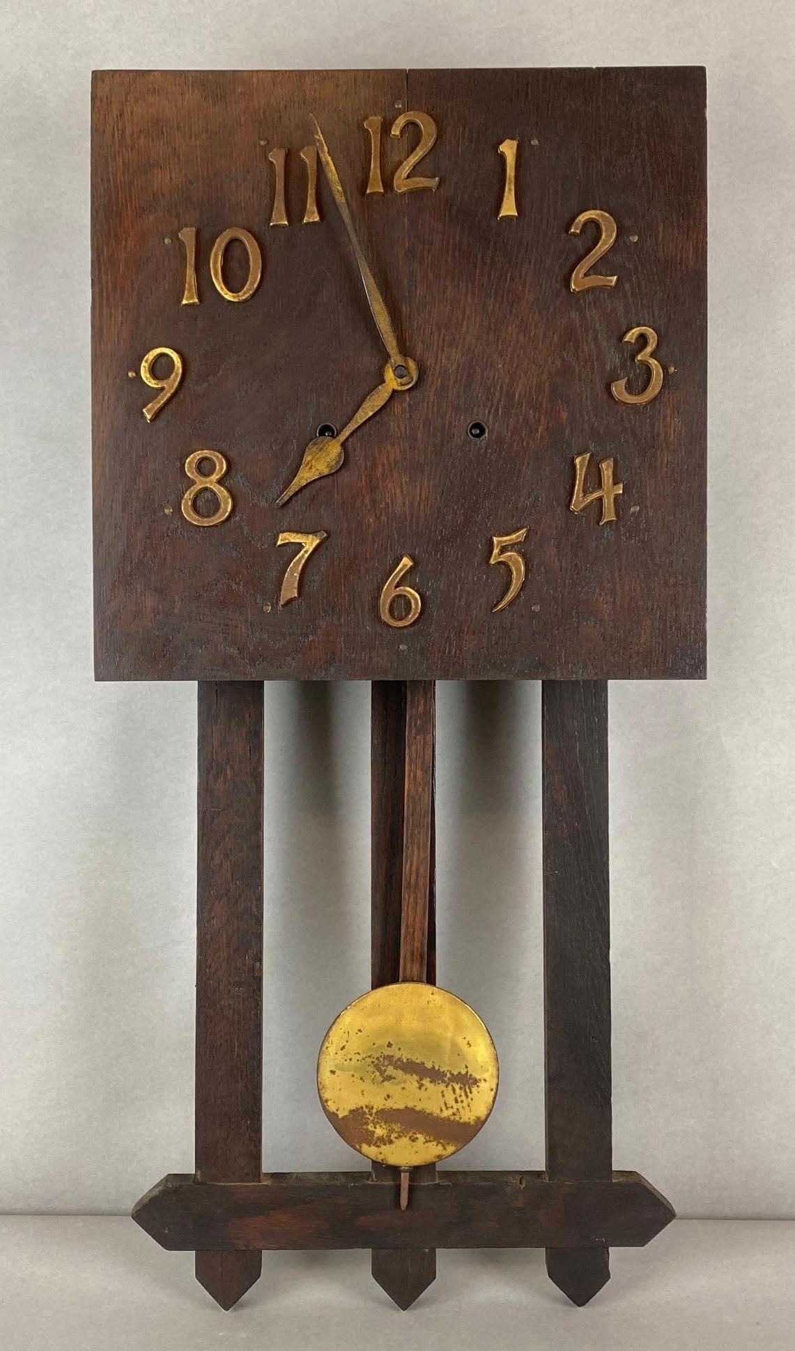 The Engraham Co Mission Style Wood Wall Clock: Bristol Connecticut, Unknown working condition, Measures 28 x 13 x 5 inches.