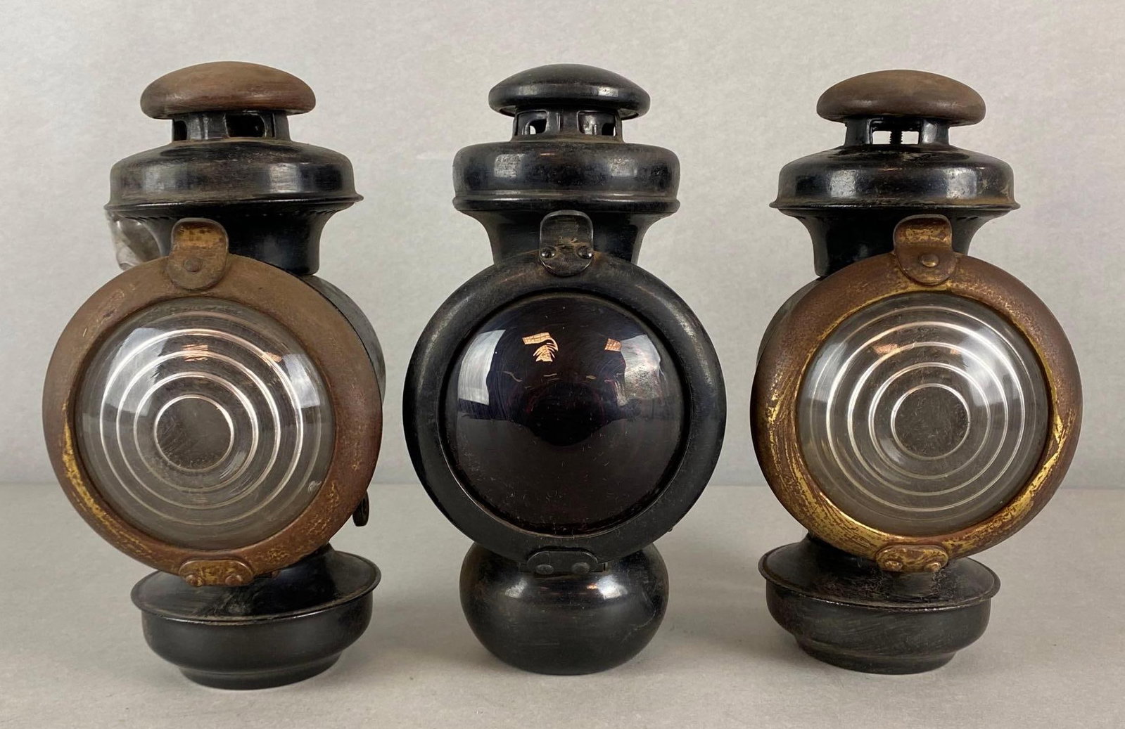 Group of 3 Bullseye Automobile Lanterns: All untested, all measures 9 1/4 x 4 3/4 x 6 inches.